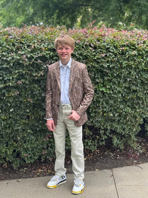 Boy wearing a Youth Mossy Oak Bottomland Perfect Pattern Sportcoat