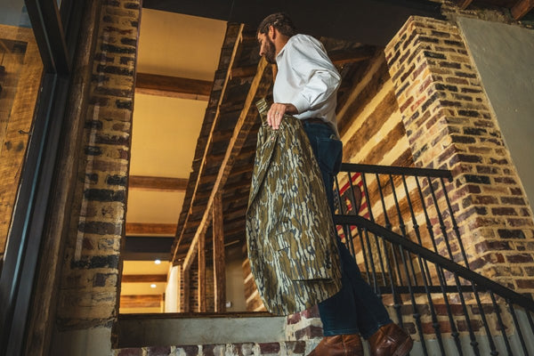 Man holding a Perfect Pattern Sportcoat in Mossy Oak Original Bottomland Pattern