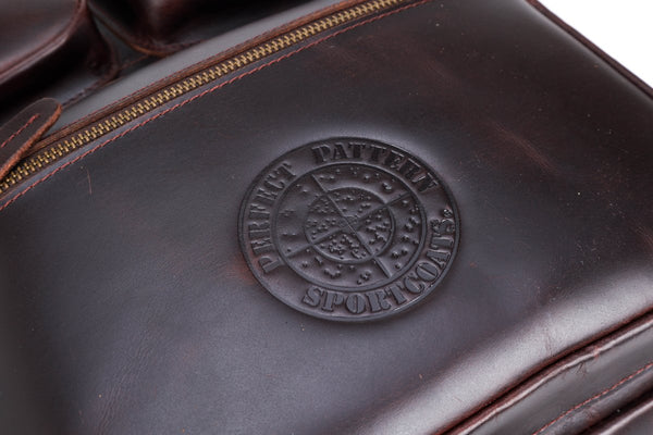 Leather briefcase with Mossy Oak Bottomland liner.  A briefcase and a backpack with camo liner.