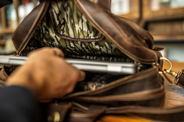 Specialty leather briefcases designed for the outdoorsman.  Full Grain Buffalo Leather with Mossy Oak Bottomland Lining