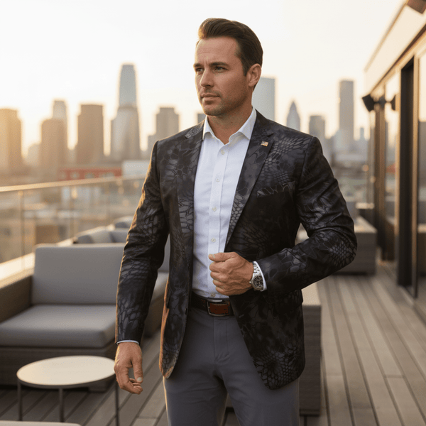 Man standing on a balcony wearing a Kryptek Typhon Blazer
